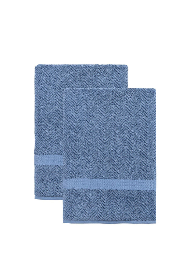 Set of two navy chevron bath sheets, neatly folded Turkish cotton towels