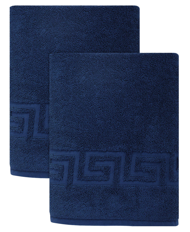 Set of two navy bath sheets with Greek key pattern border, overlapped and folded