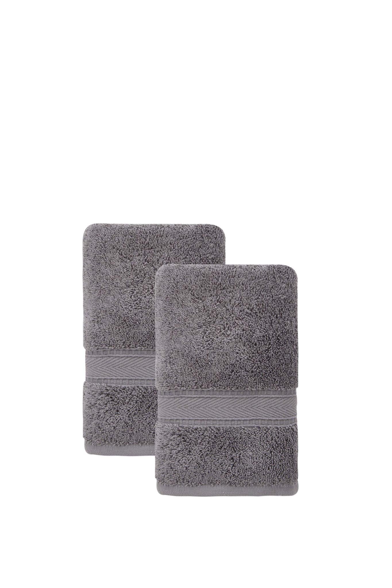 Set of two dark gray Turkish cotton hand towels, neatly folded with ribbed borders