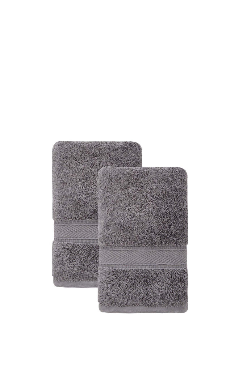 Set of two dark gray Turkish cotton hand towels, neatly folded with ribbed borders