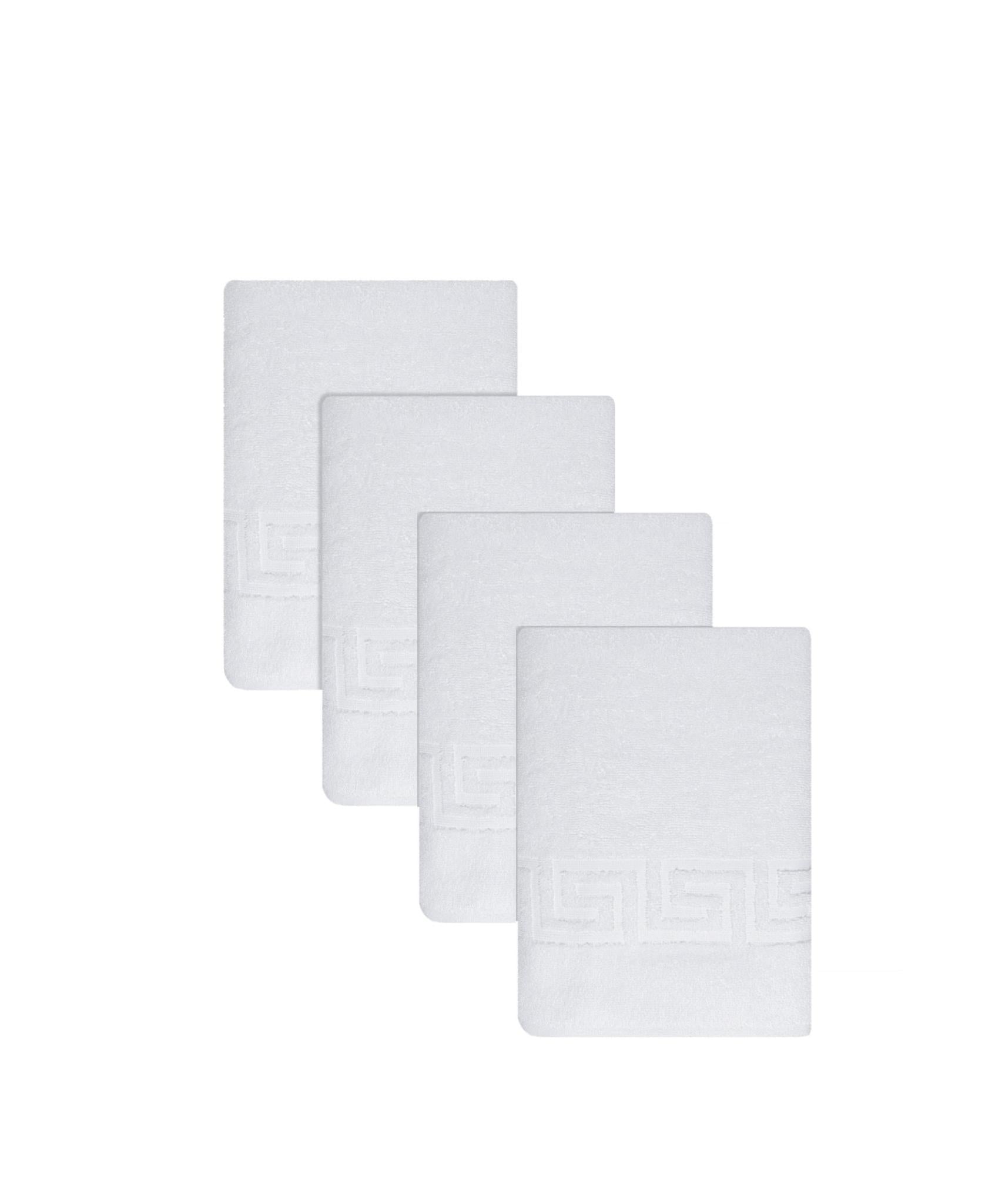 Set of white Turkish cotton bath towels with Greek key border, folded