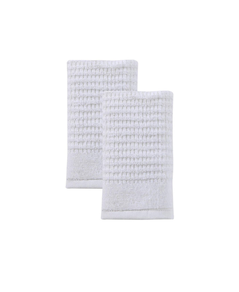 Set of two white Turkish cotton hand towels, textured weave, folded with layered edges
