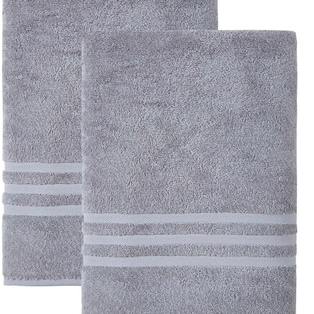 Stacked light gray bath towels set of two, with textured looped fabric and stripes.