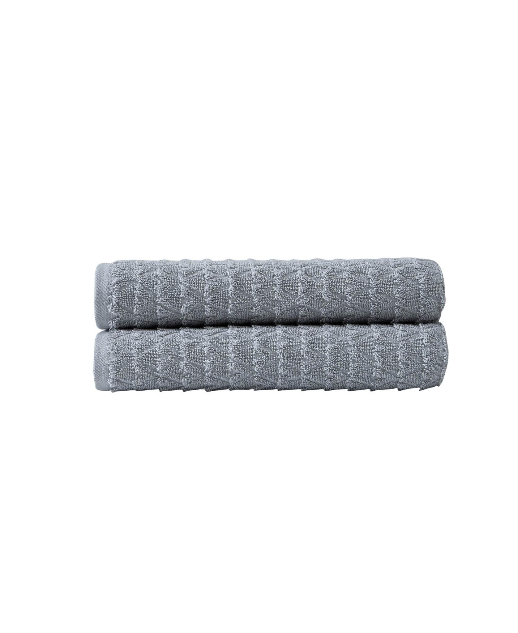 Set of two light gray bath towels with geometric pattern, neatly stacked