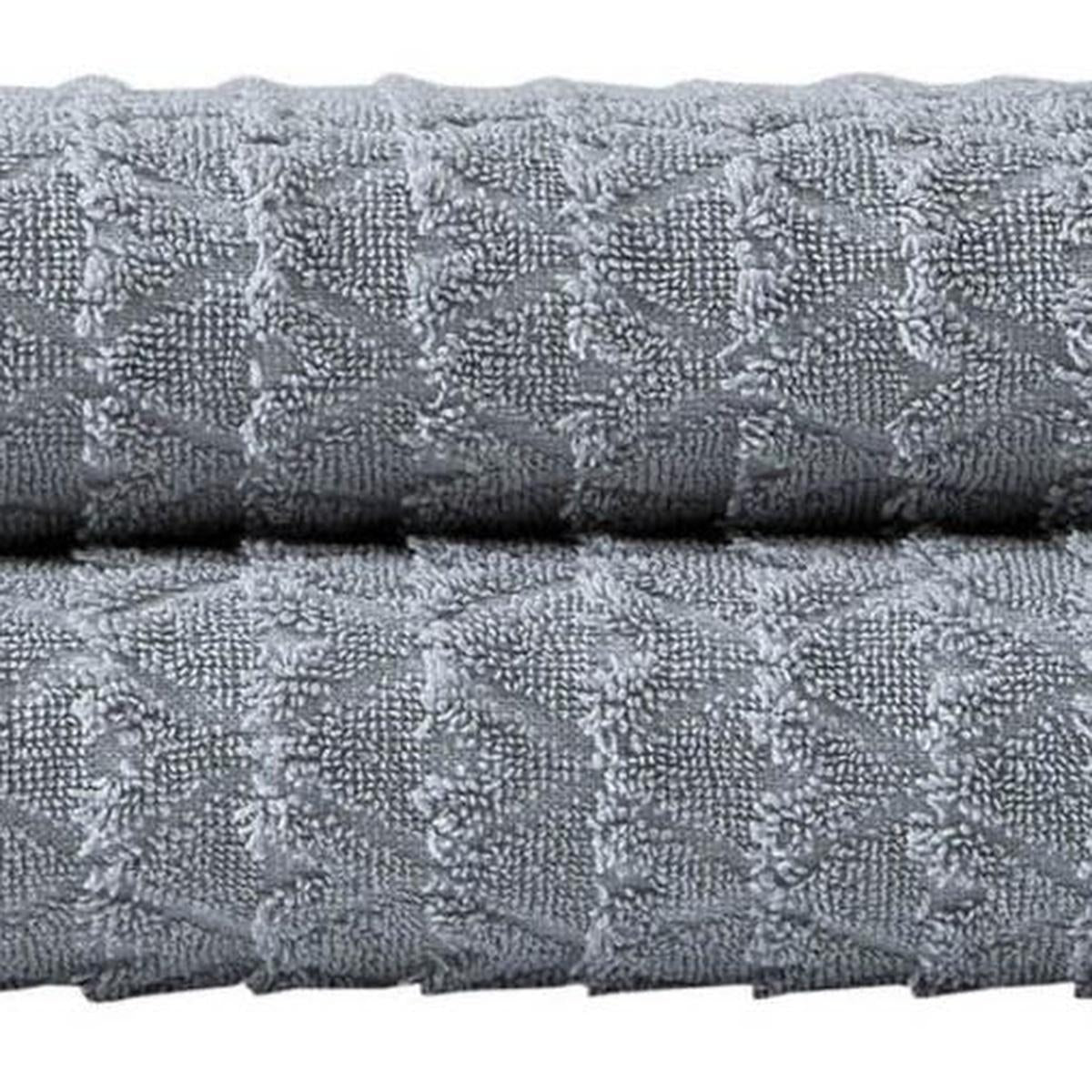 Light gray bath towel fabric with raised geometric pattern, cotton terry texture