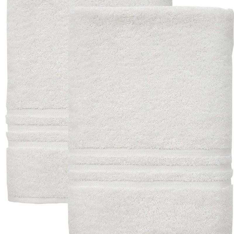 Set of two off-white bath towels close-up, terry texture with stitched border bands