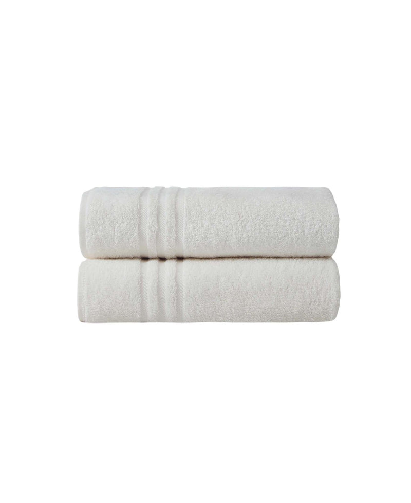 Set of two off-white bath towels, stacked and rolled, textured terry surface