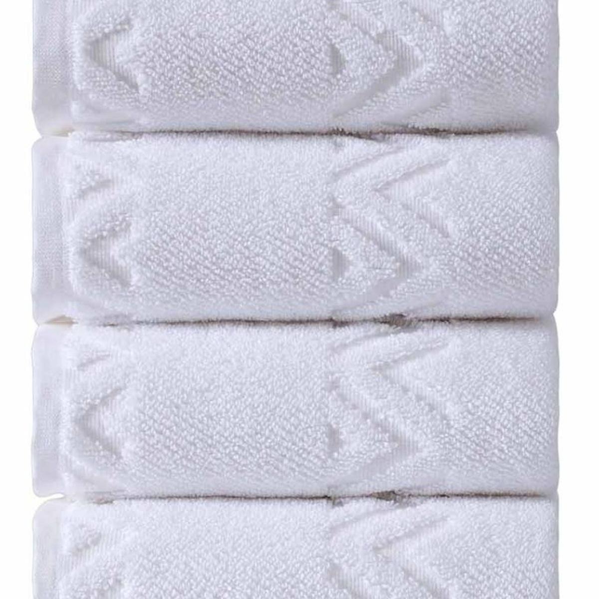 Close-up of white hand towel fabric with woven geometric diamond pattern