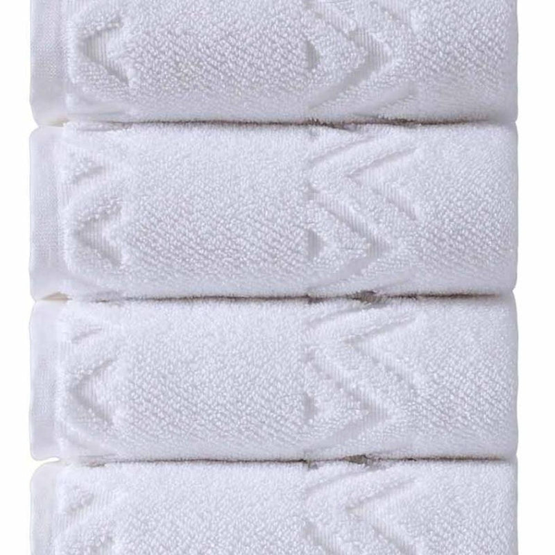 Close-up of white hand towel fabric with woven geometric diamond pattern
