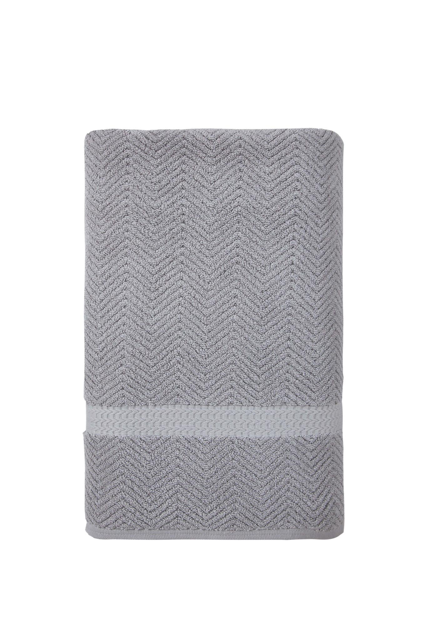 Gray Turkish cotton bath towel, rolled bundle with chevron texture and border band