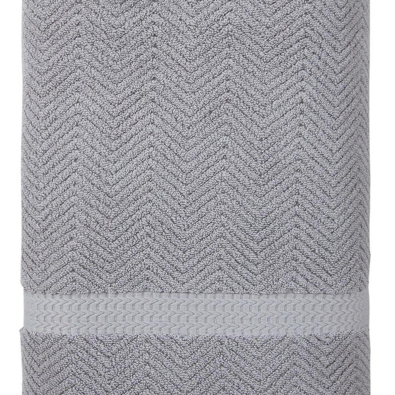 Gray Turkish cotton bath towel with chevron texture and stitched hem, close-up
