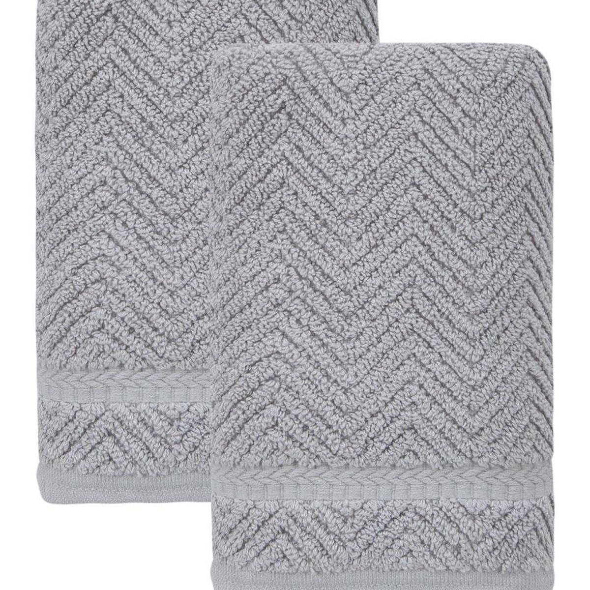 Set of two light gray chevron hand towels with textured borders, folded