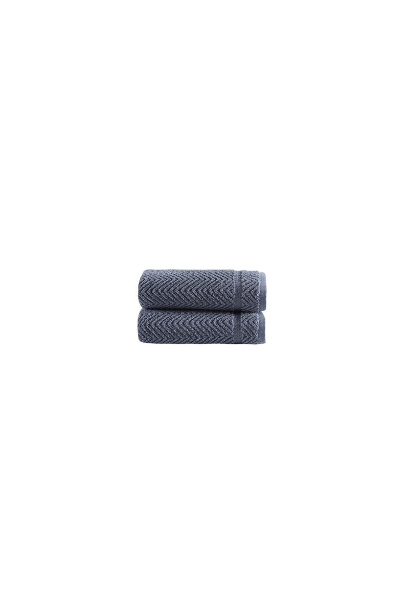 Set of two dark gray chevron hand towels, neatly folded on white background