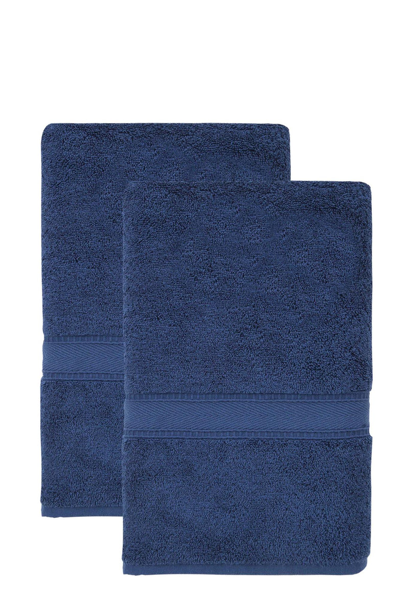 Set of two navy bath sheets, two folded towels with textured looped fabric