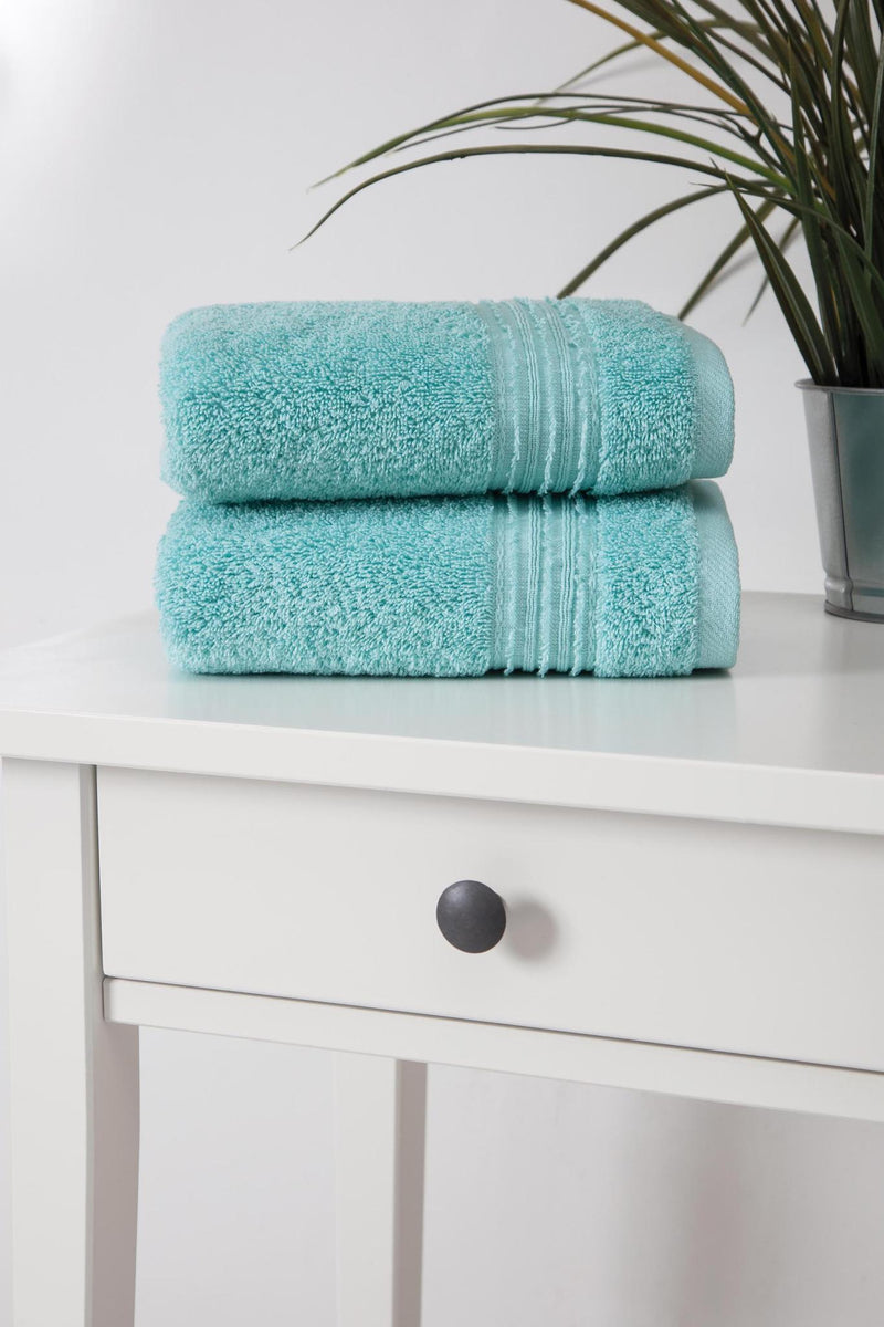 Aqua terry hand towel set of two, stacked and folded with ribbed trim.