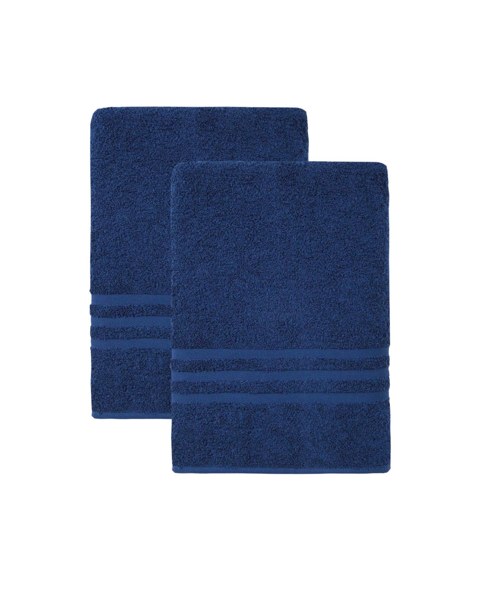 Set of two navy Turkish cotton bath towels, one folded behind the other, plush texture