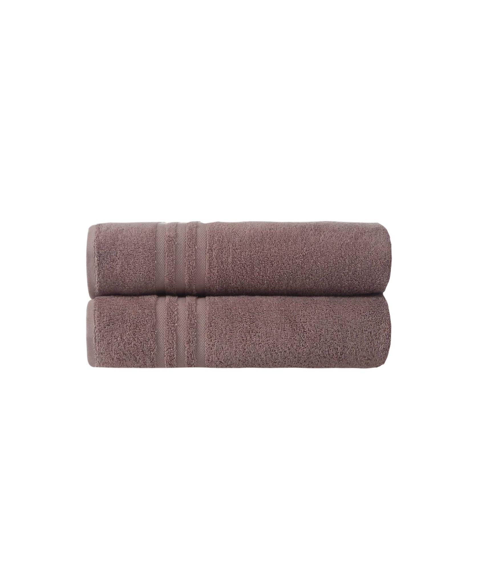 Two folded brown bath towels with striped border bands and plush terry loop pile