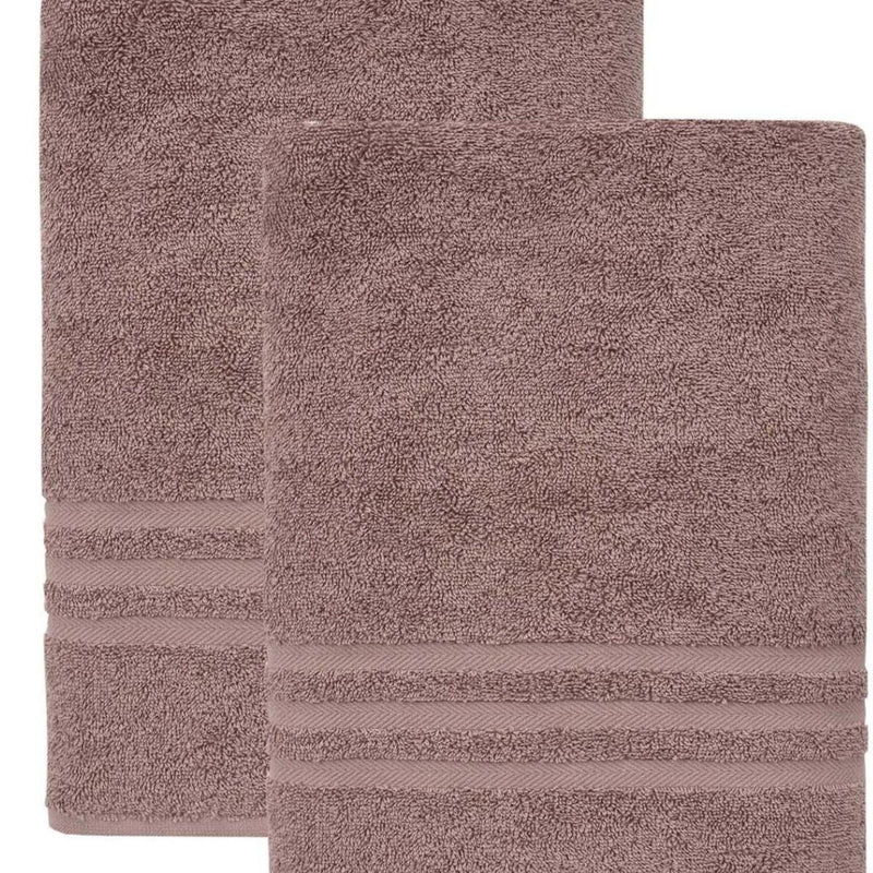 Close-up of brown terry bath towels with woven horizontal stripe border detail