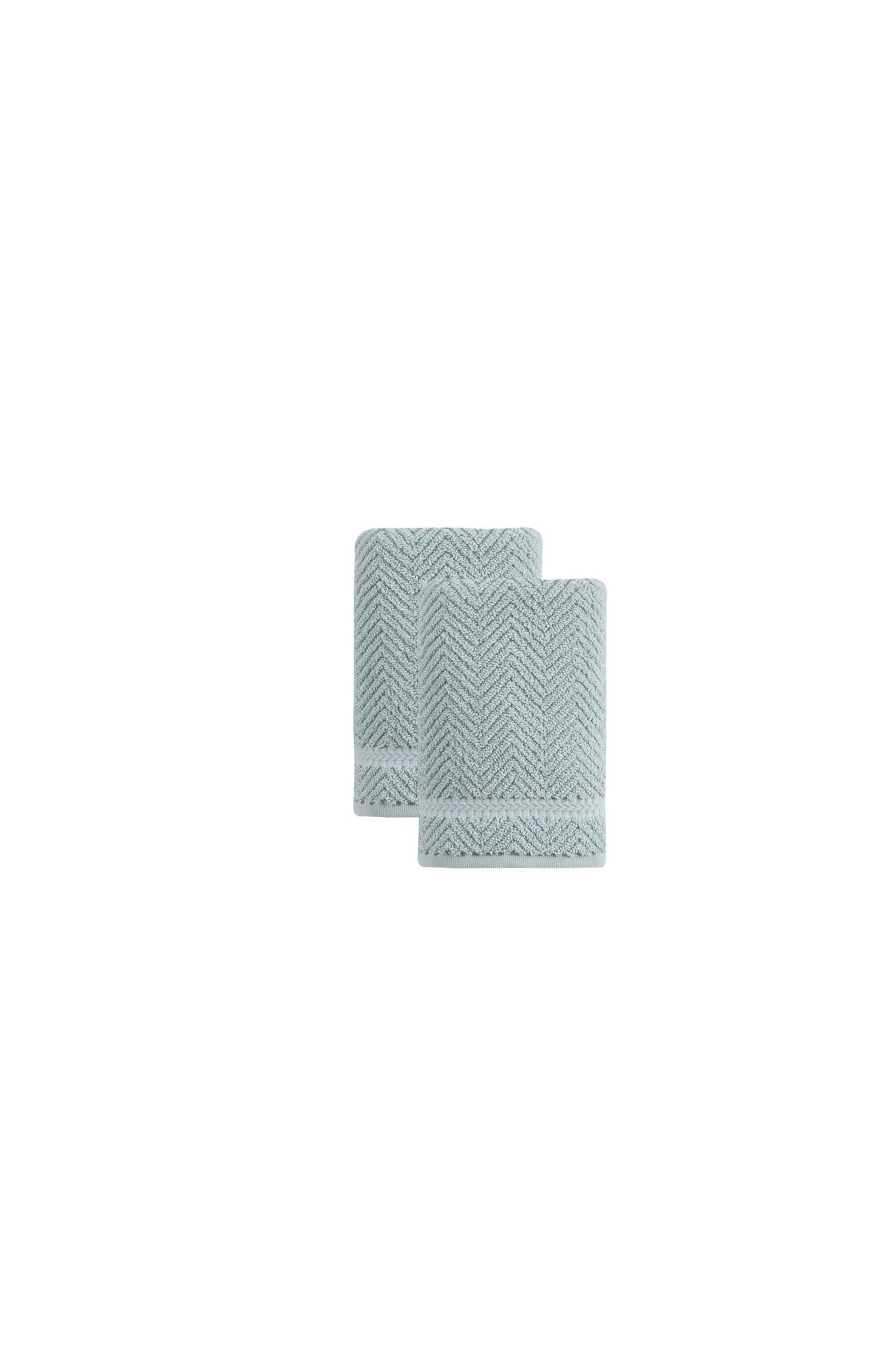 Two aqua chevron Turkish cotton hand towels, neatly folded stack