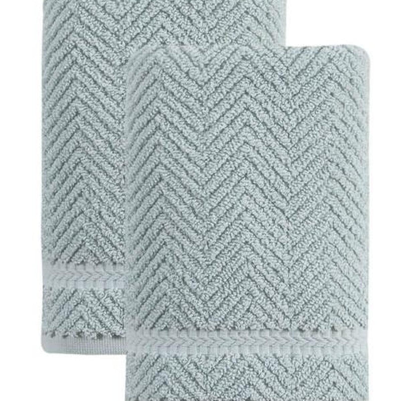 Aqua chevron Turkish cotton hand towel with textured zigzag pattern, close-up