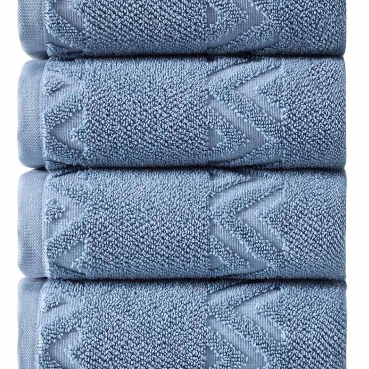 Close-up of blue Turkish cotton hand towel stack with geometric chevron pattern stitching