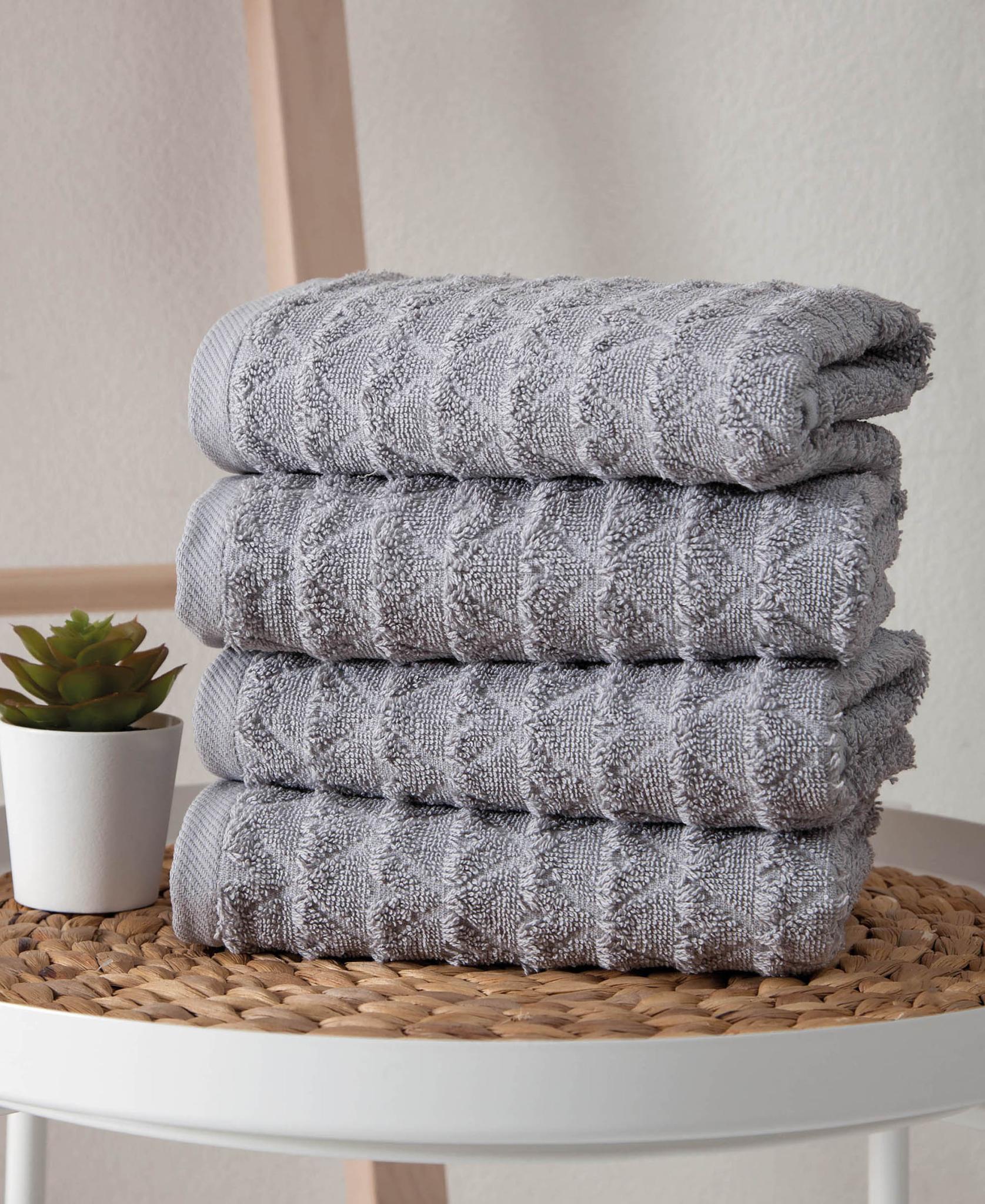 Light gray geometric Turkish cotton hand towels, folded stack