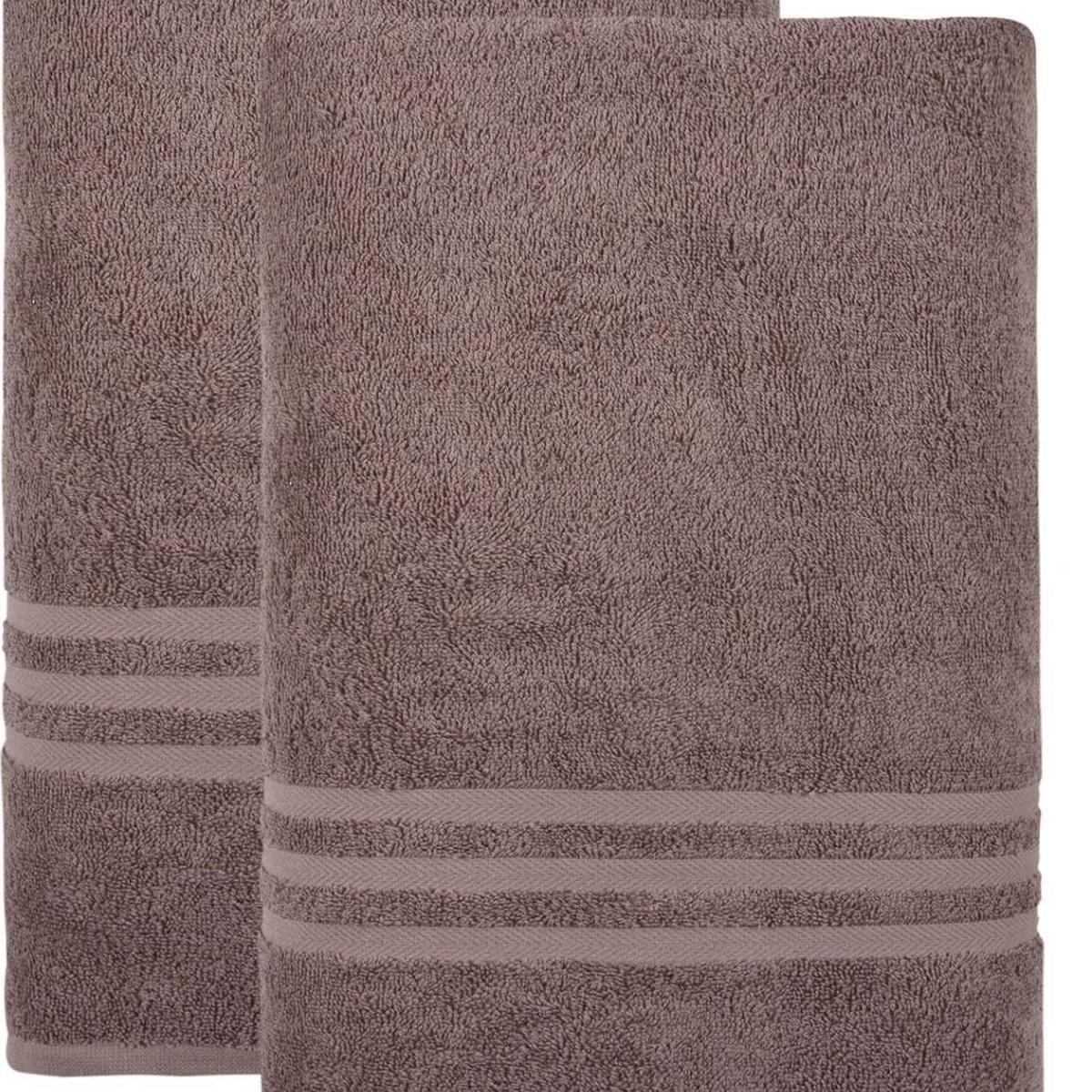 Mauve bath towel close-up, textured terry loops and horizontal striped border