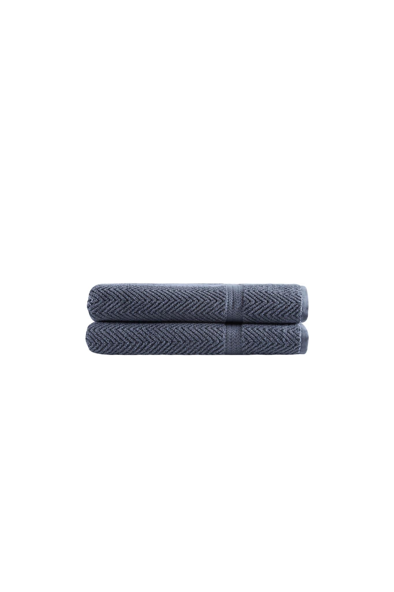 Set of two light gray chevron bath towels, neatly stacked