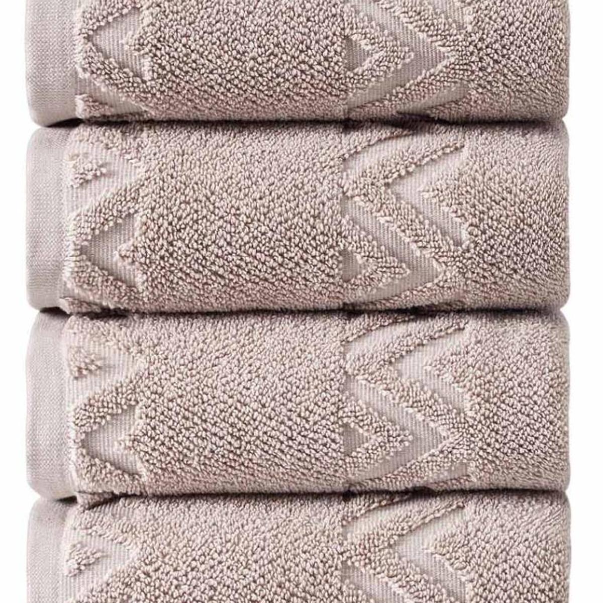 Set of four hand towels in light taupe with raised geometric diamond pattern