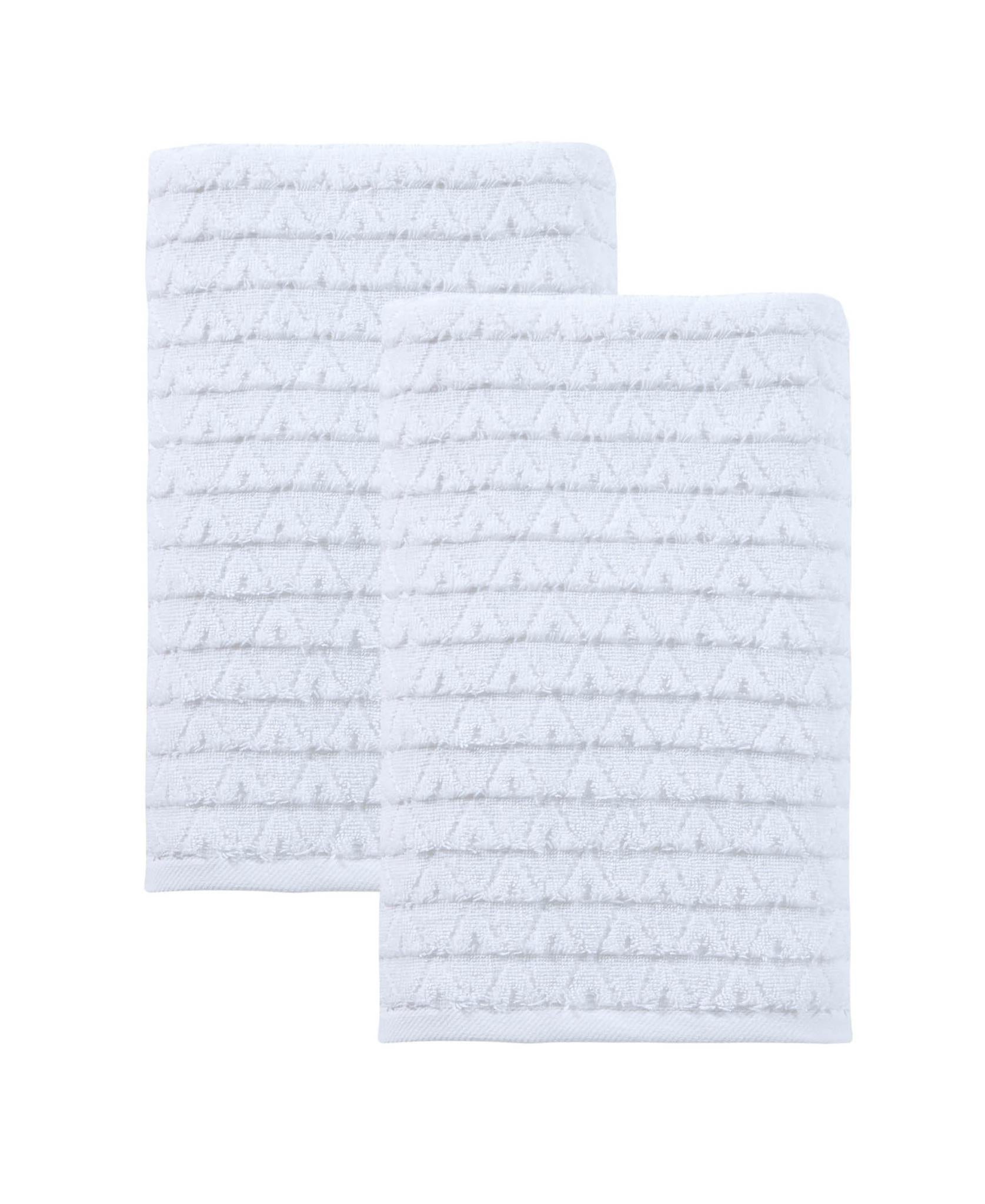 Set of two white Turkish cotton bath towels with subtle geometric woven pattern