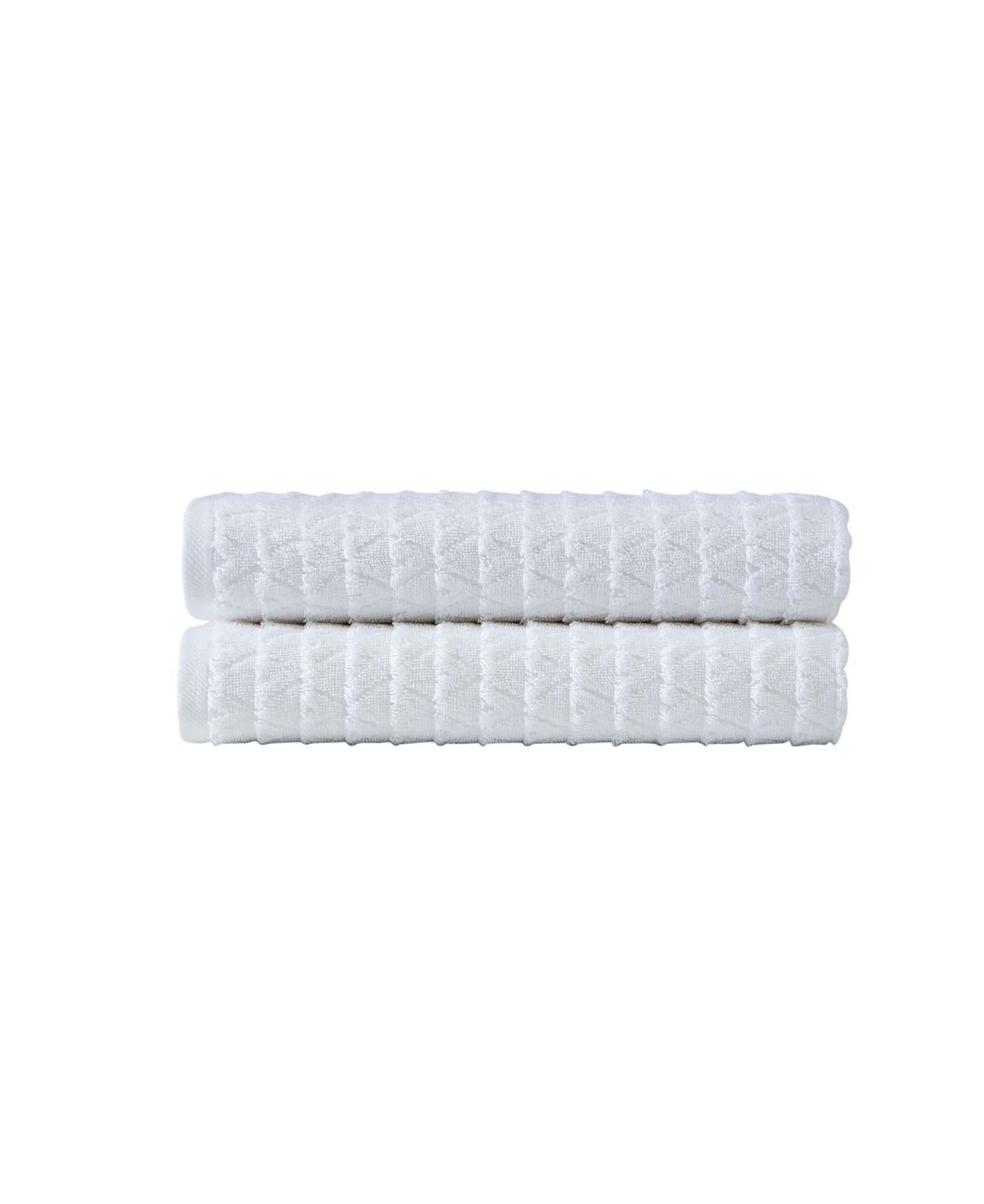Set of two white bath towels, folded stacks with textured geometric stripe pattern