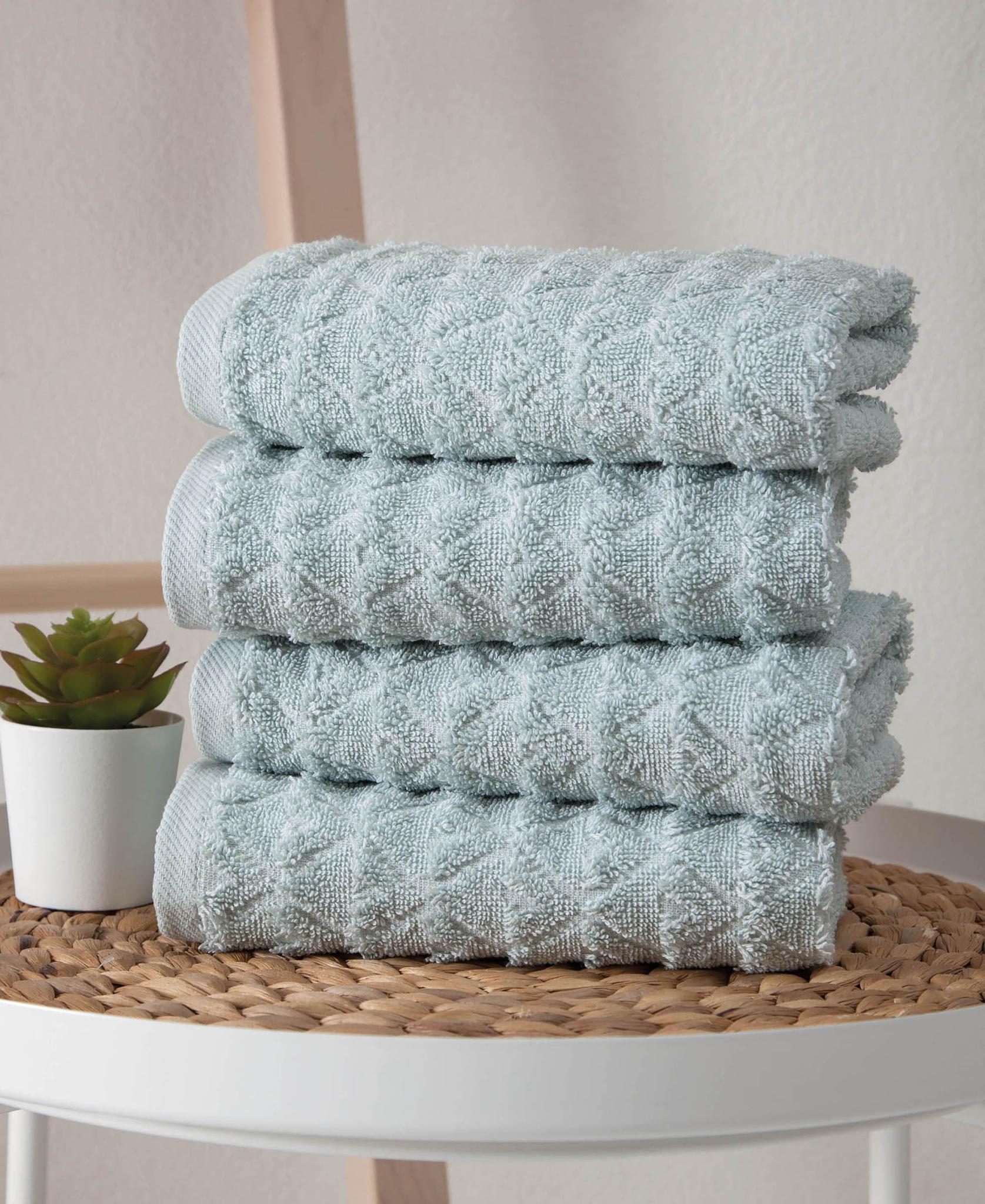 Four aqua geometric Turkish cotton hand towels, 16x30 in, folded stack