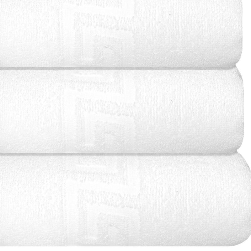 Set of three white Turkish hand towels, textured pile with Greek key pattern detail