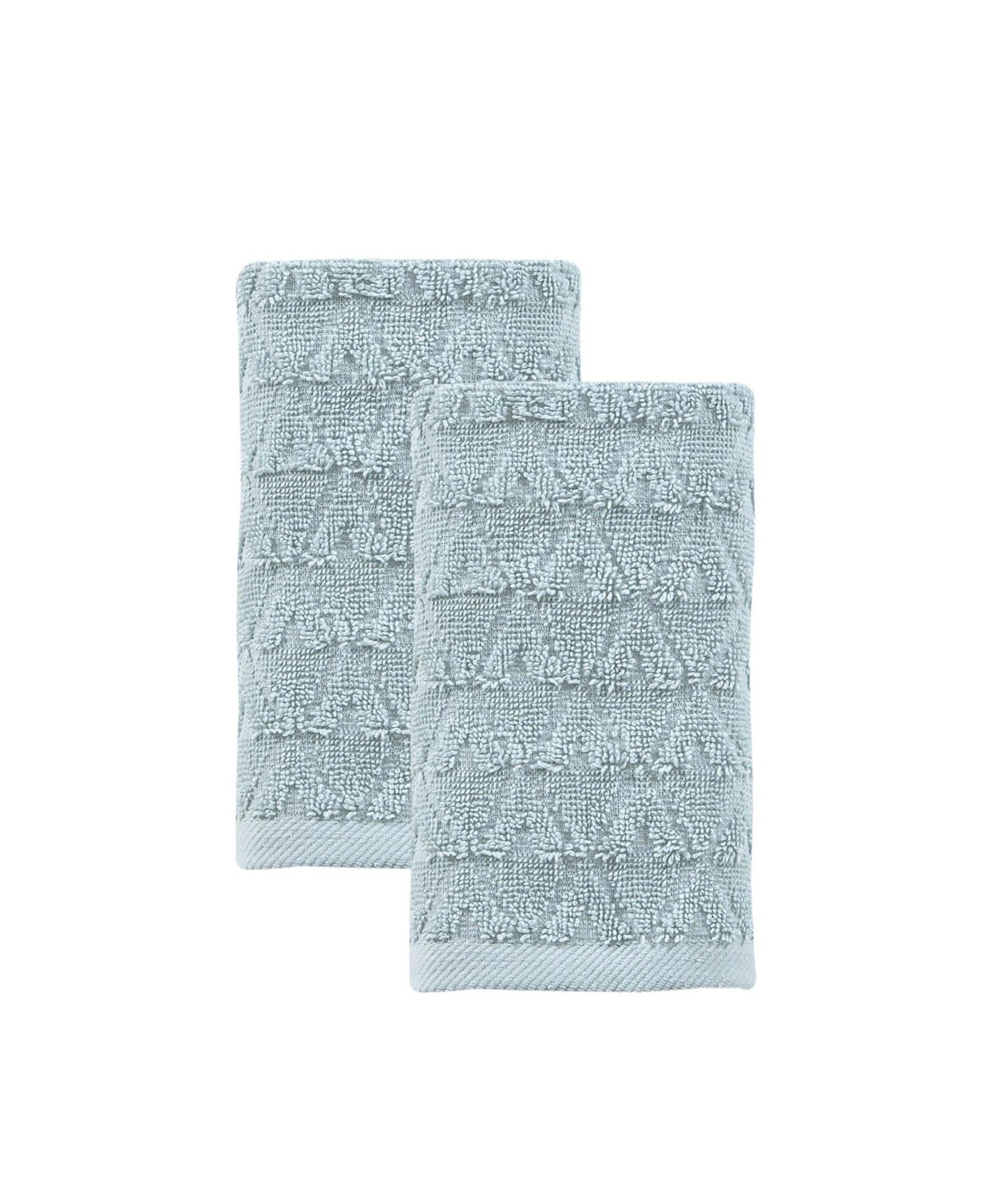 Set of two aqua Turkish hand towels, overlapping folds, textured geometric design.