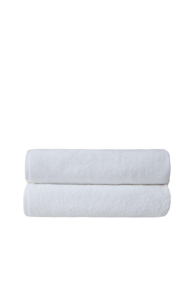 Set of two white bath sheets, rolled and stacked