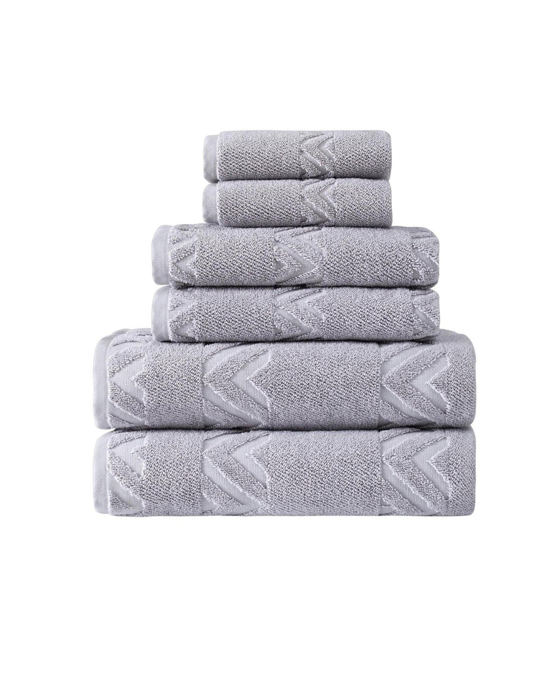 Folded light gray Turkish cotton towels with geometric chevron design