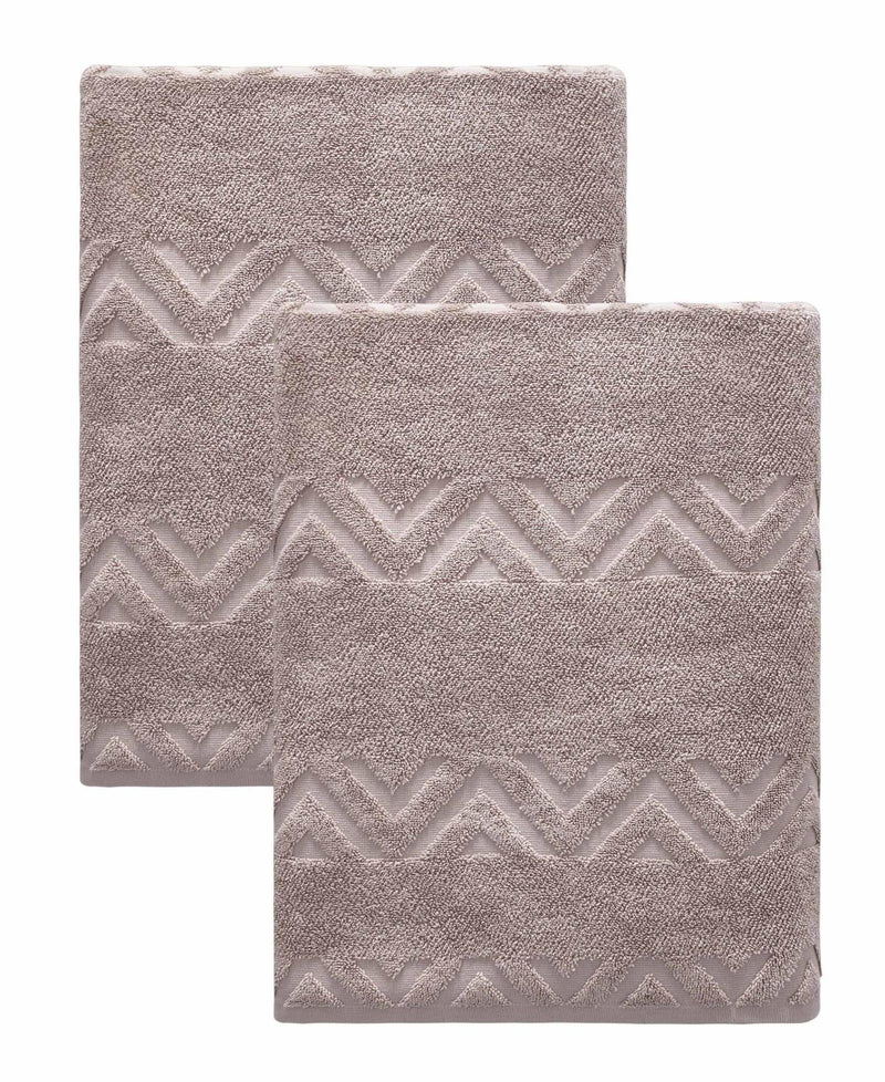 Set of two taupe bath towels with embossed chevron design and stitched edges