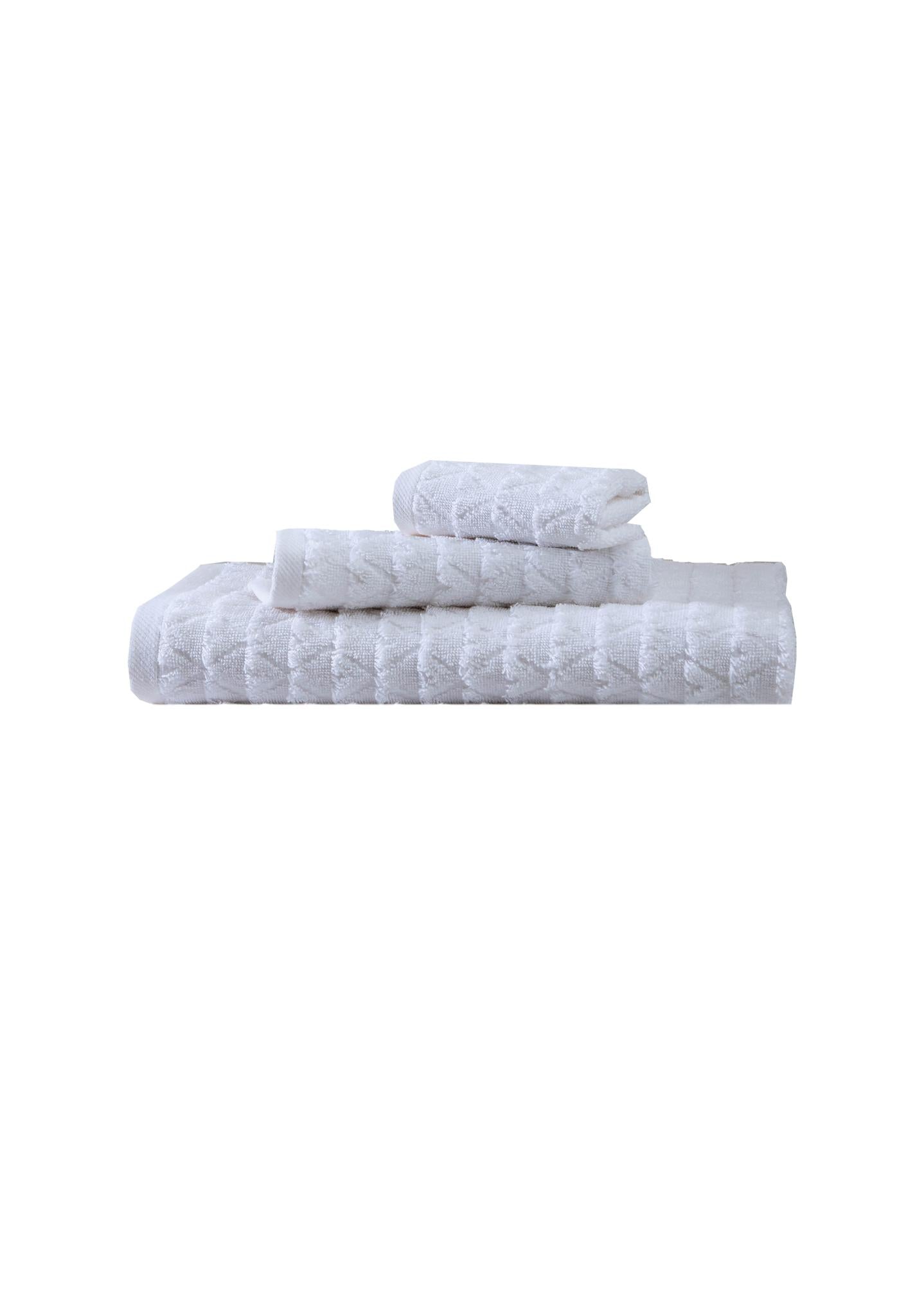 Set of three white Turkish cotton towels, folded and stacked, geometric weave
