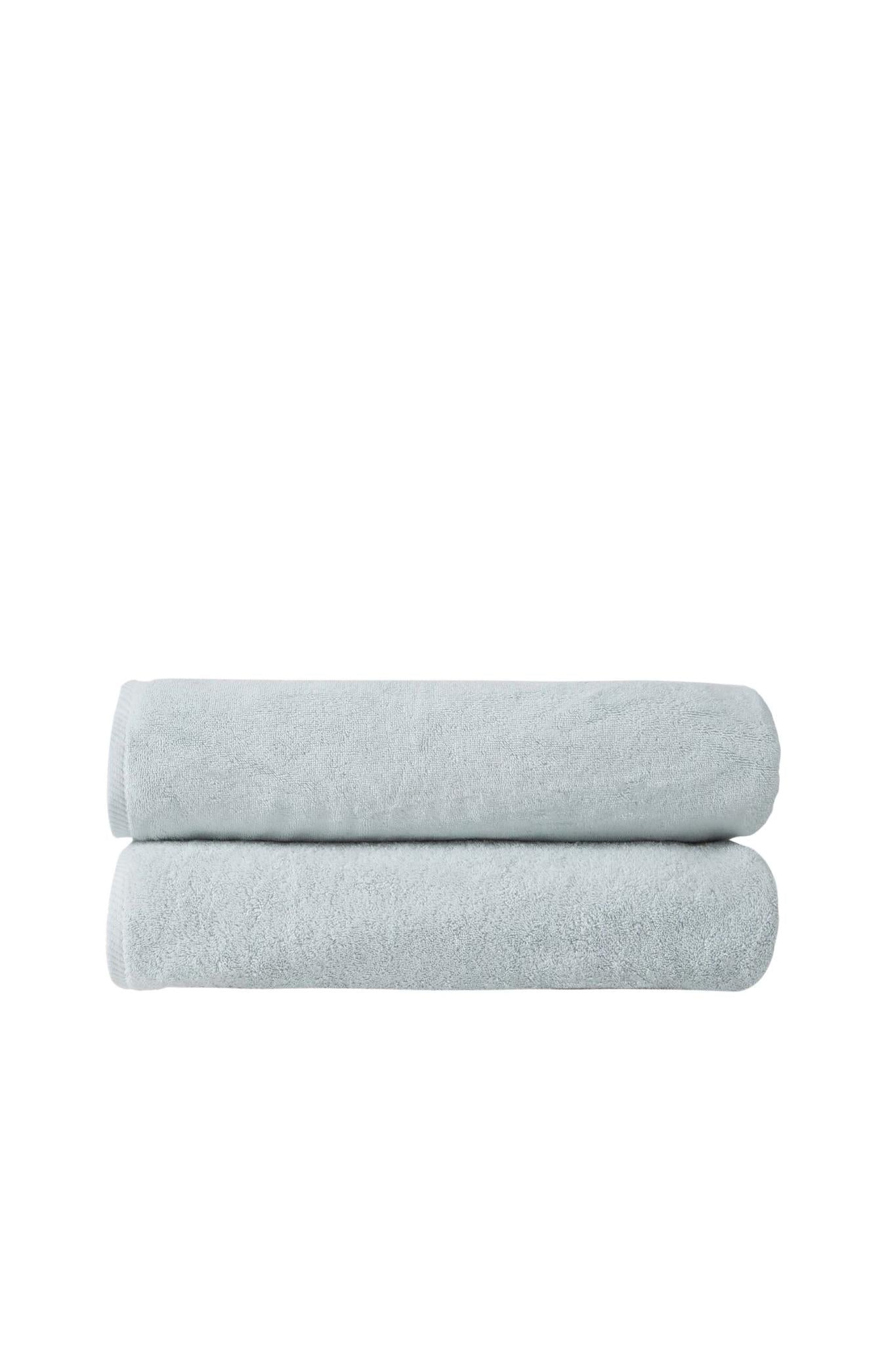 Set of two aqua Turkish cotton bath sheets, stacked and folded, terry texture