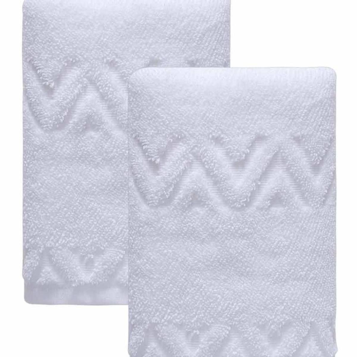 Set of two white hand towels, folded view with detailed geometric zigzag pattern