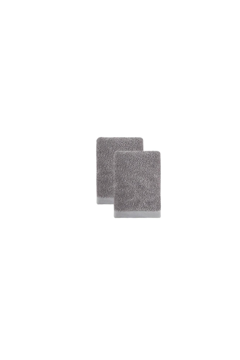 Light gray Turkish cotton hand towel pair, folded terry cloth, staggered