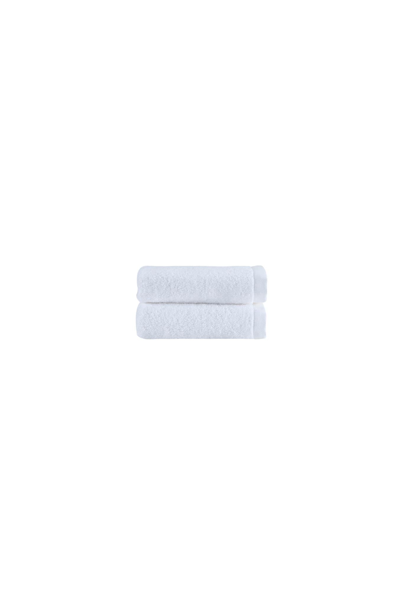 Set of two white Turkish cotton hand towels, 16x30 in, neatly folded stack