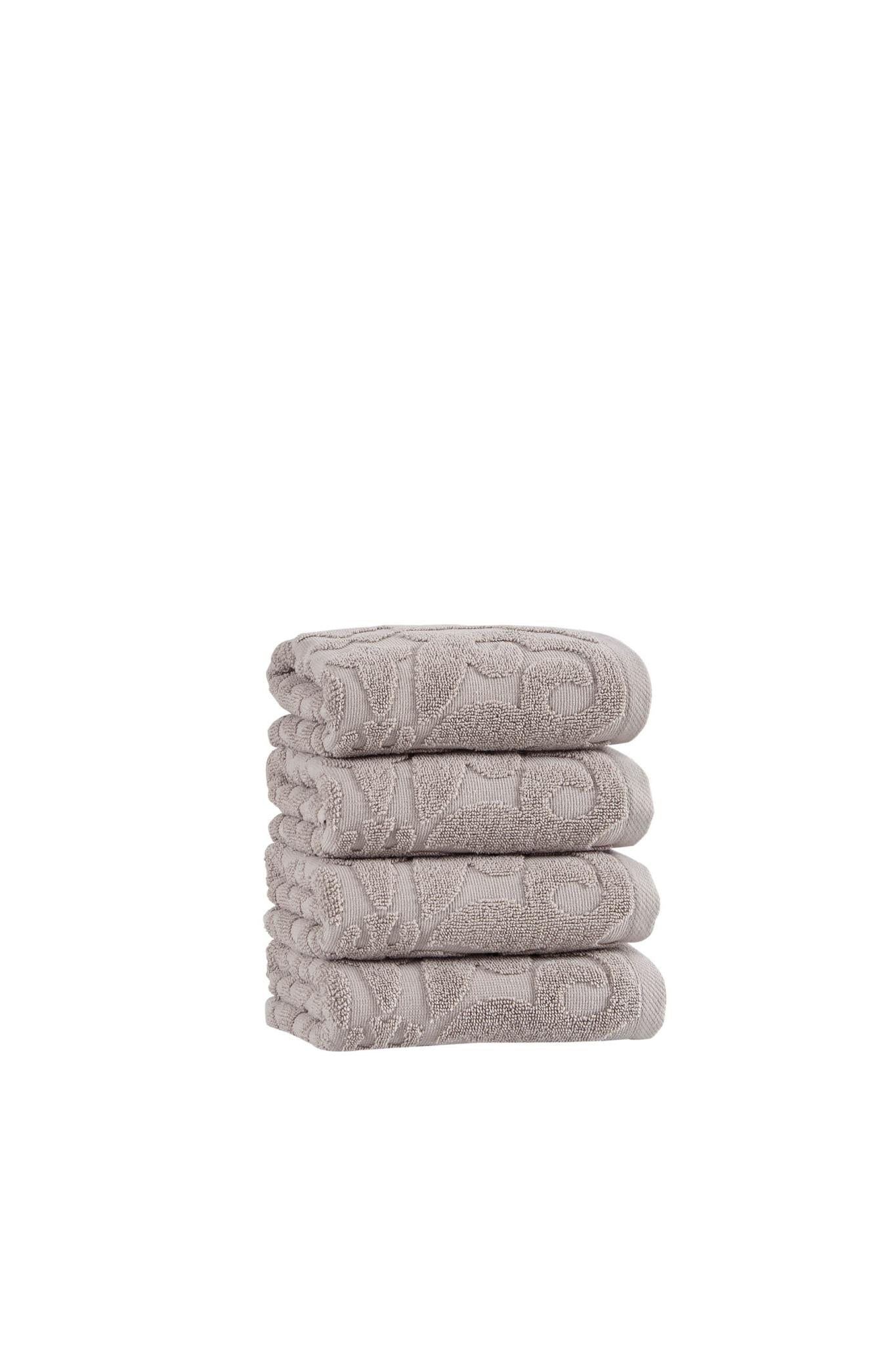 Set of four hand towels, light gray floral texture, folded stack