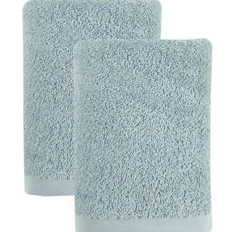 Set of two light blue hand towels, close-up of plush terry texture and edges.