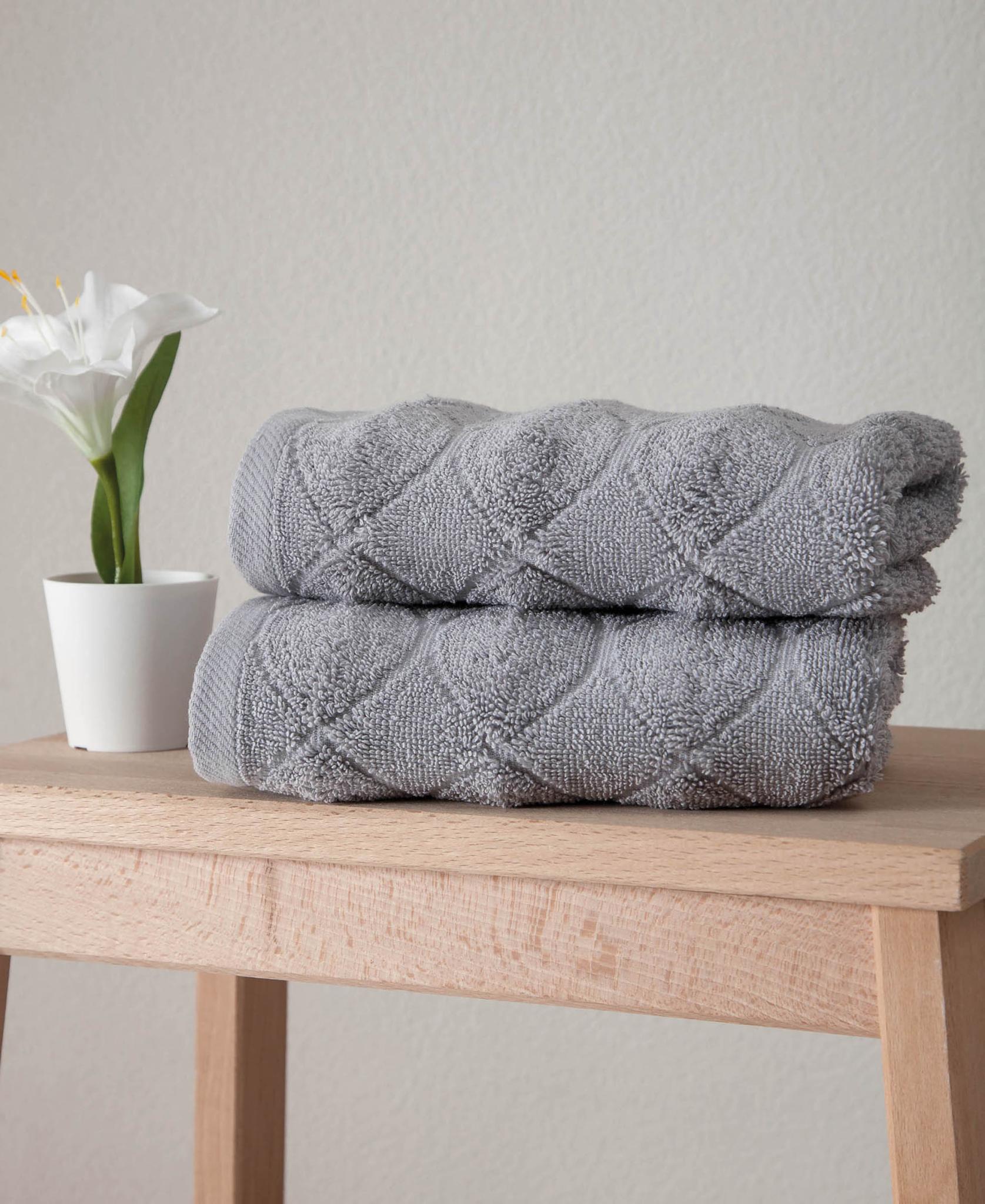 Light gray Turkish cotton hand towels set of two, folded with diamond geometric weave