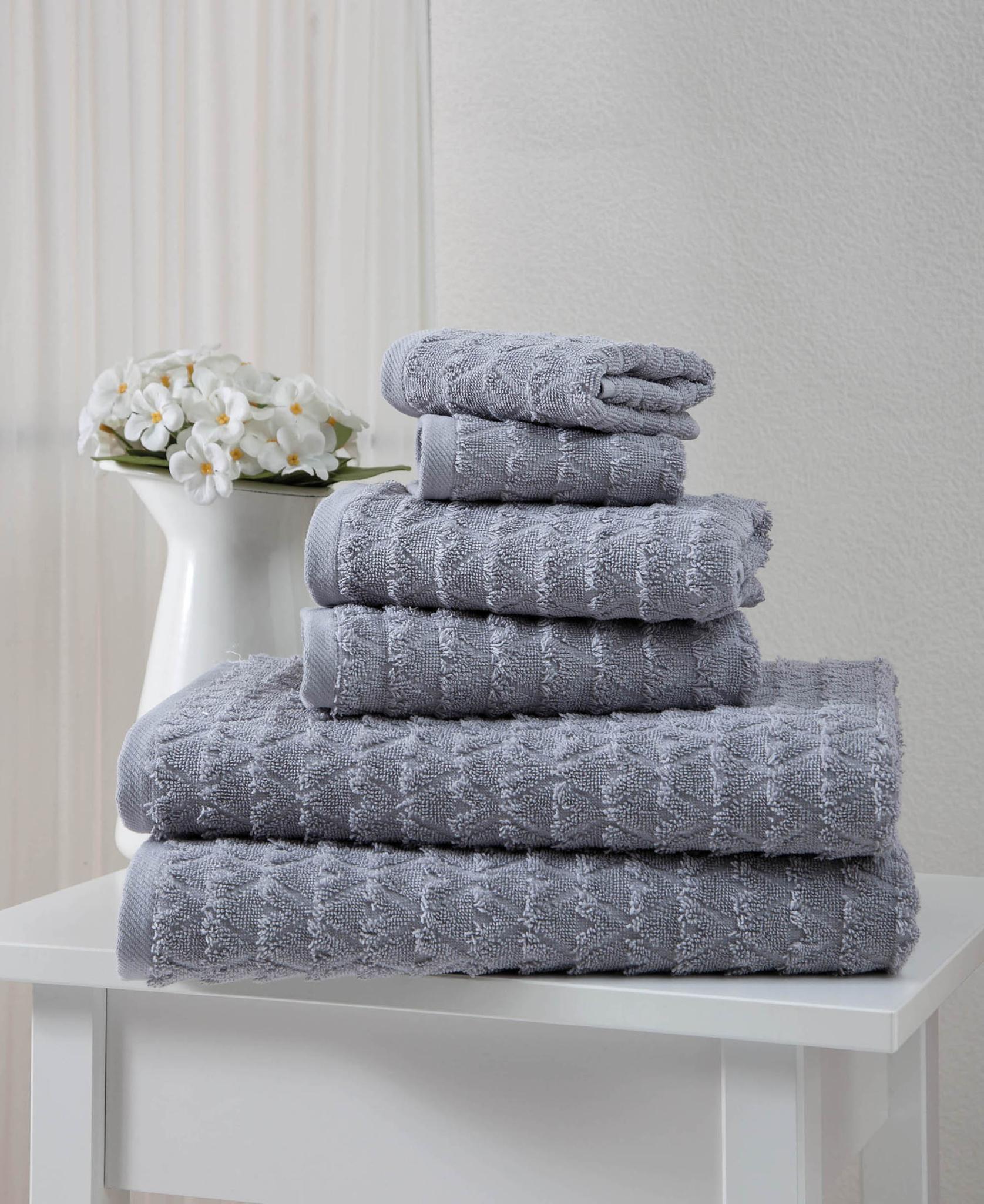 Light gray geometric Turkish cotton towel set, folded stack of 6 with textured pattern