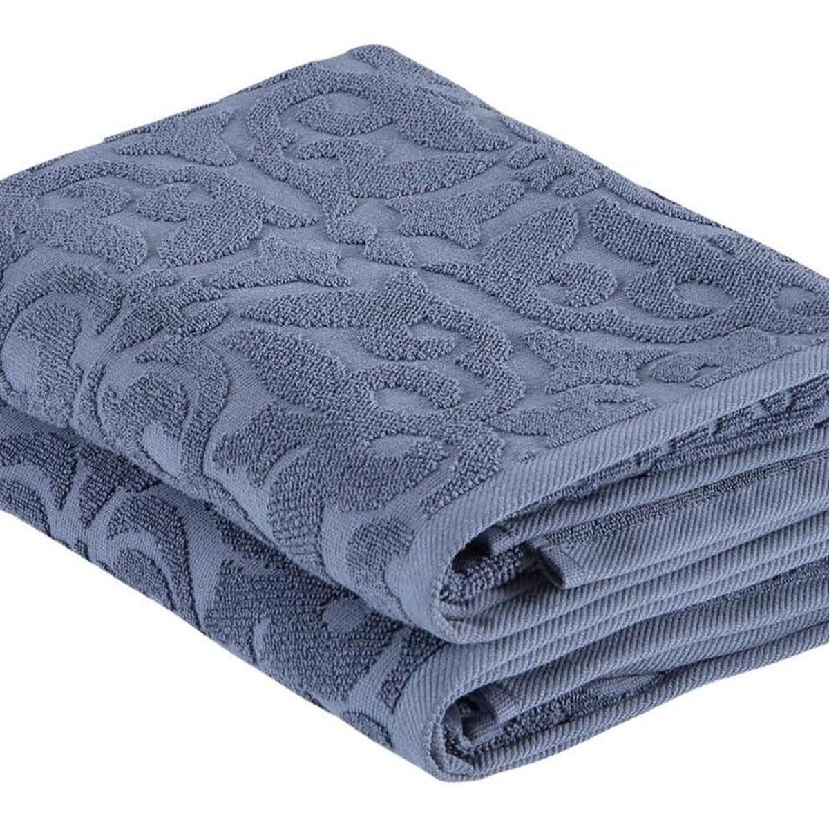 Navy floral Turkish cotton bath towel close-up, raised floral jacquard and stacked folds