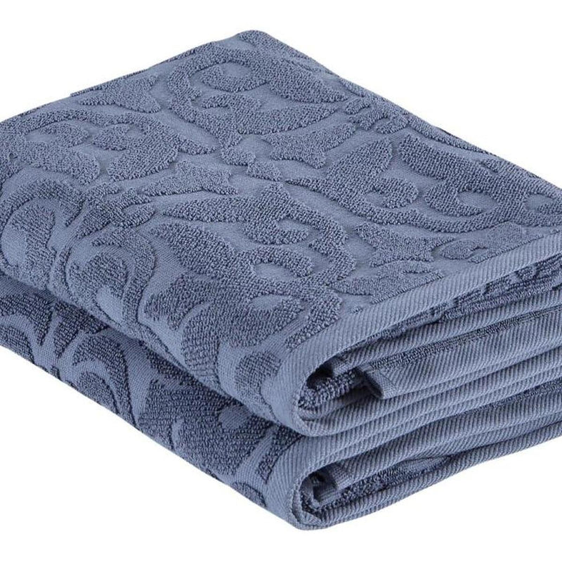 Navy floral Turkish cotton bath towel close-up, raised floral jacquard and stacked folds