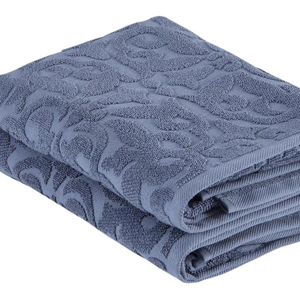 Navy floral Turkish cotton bath towel with raised jacquard pattern, folded edge visible