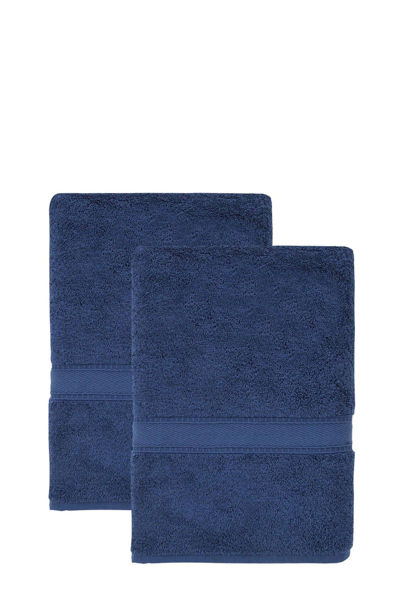 Set of two navy Turkish cotton bath towels stacked, terry pile, stitched edge